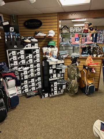 A display of various style of golf shoes at the pro shop.