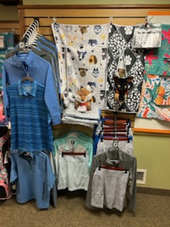 A display of various style of golf clothes at the pro shop.
