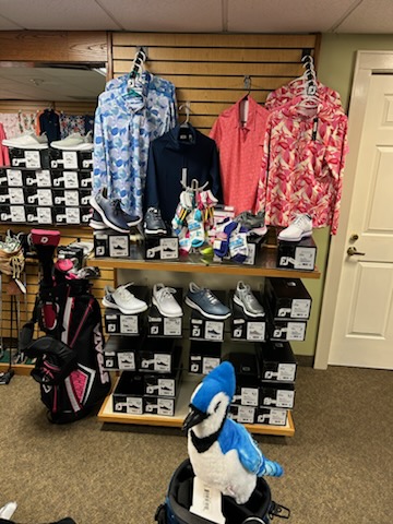 A display of various style of golf clothes at the pro shop.