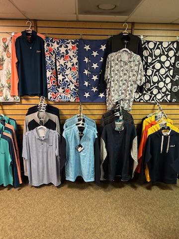 A display of various style of golf clothes at the pro shop.