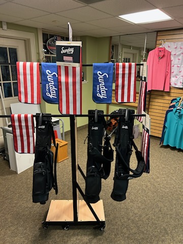 A display of various style of golf clothes at the pro shop.